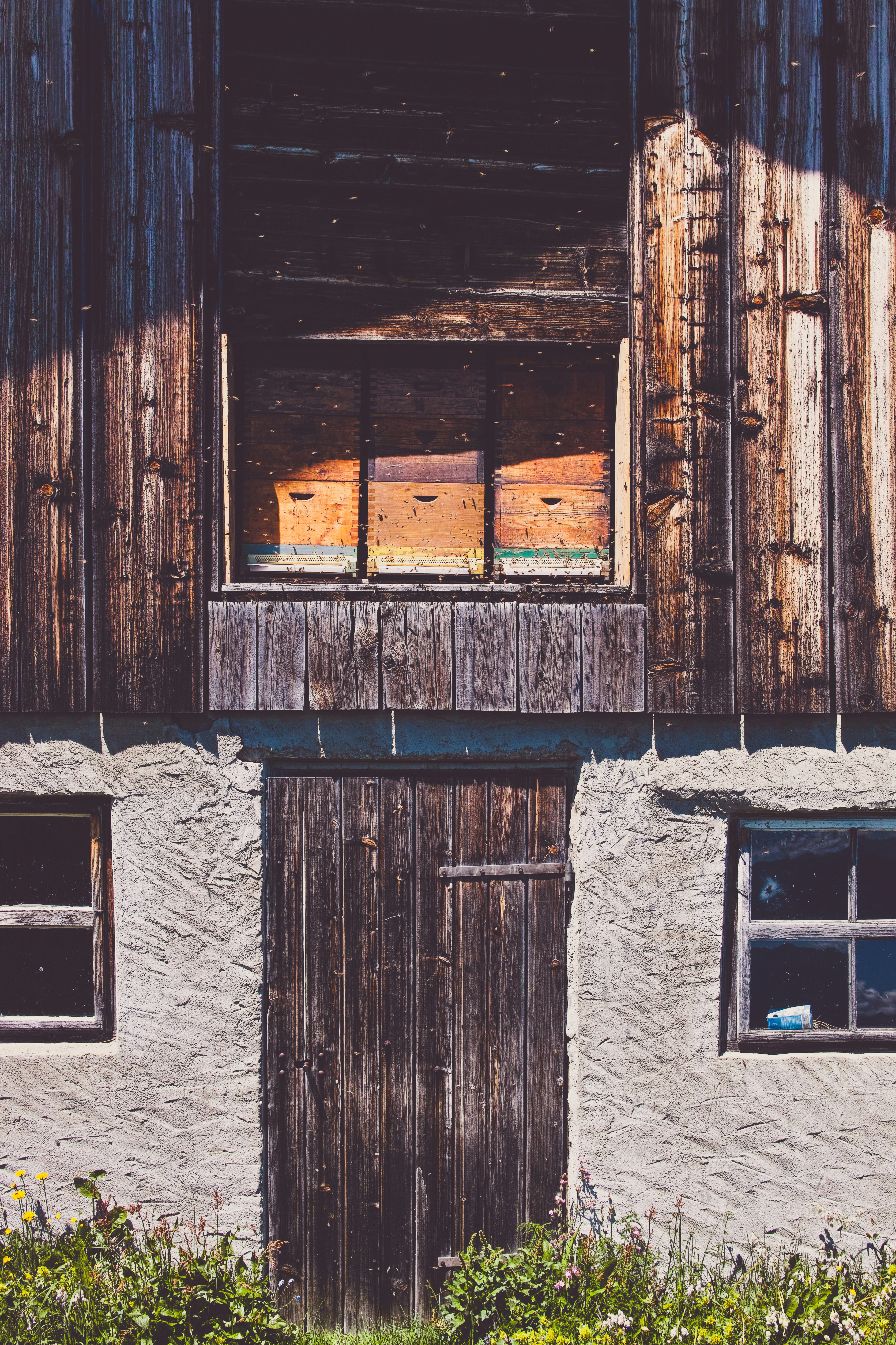 brown wooden window on gray concrete wall